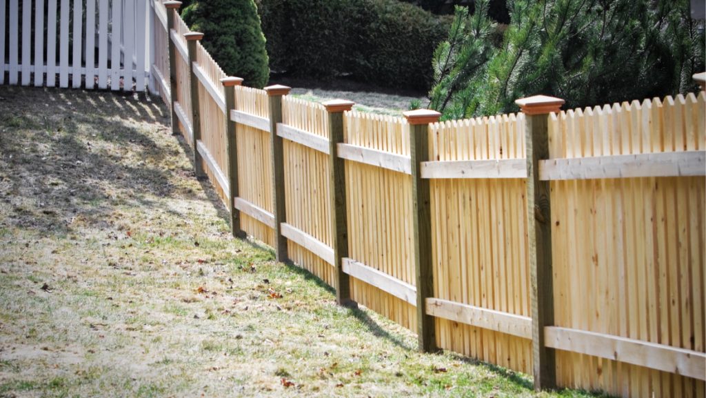 Traditional cedar wood picket fence